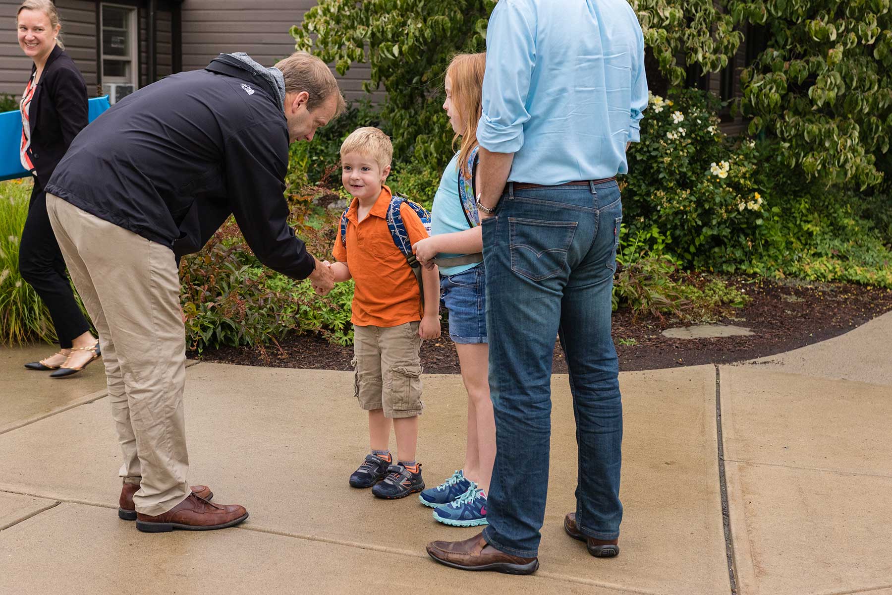 Head Brendan Largay greets a pre-k student on the first day of school
