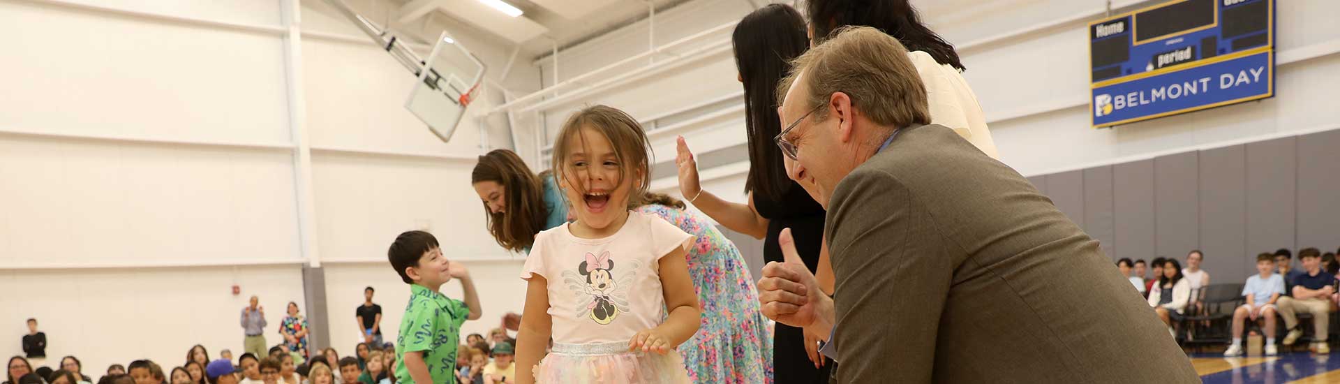 A smiling student gets a thumbs-up from Mr. Largay