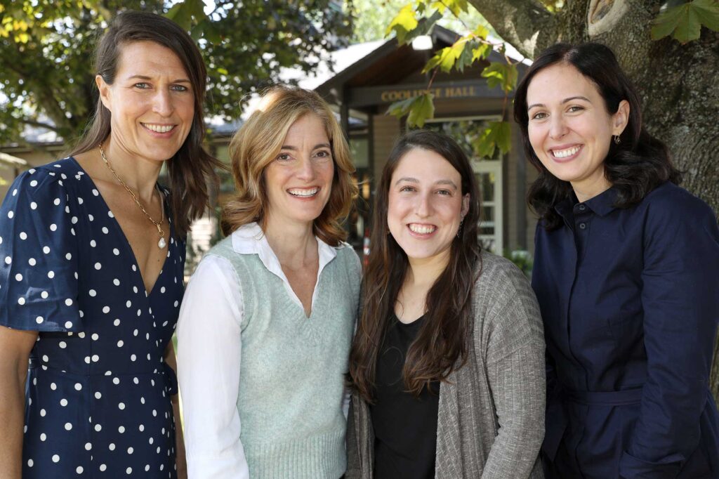 Liz Parfit, Judy Bright, Elena Jay, Emina Kadric stand outside of Coolidge Hall