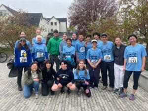 Alumni, faculty, and families pose at the Dana Chang '21 Foundation 5K